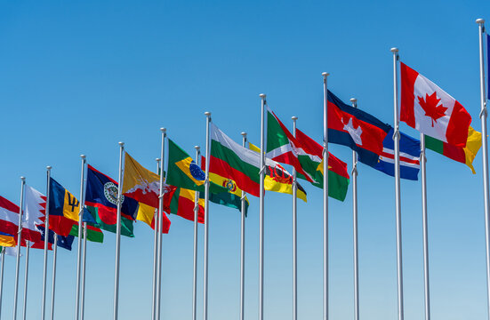 Flags of multiple countries representing international diplomacy and language differences in global news coverage.